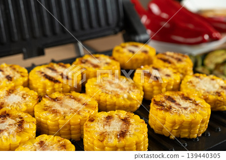 Grilled Corn on the Cob Rounds Close-up on Electric Grill Grilled Corn on the Cob Rounds Close-up on Electric Grill 139440305