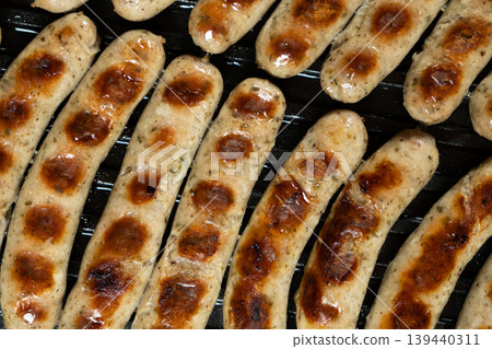 Home BBQ. Grilling Sausages on Open Contact Grill Plate Home BBQ. Grilling Sausages on Open Contact Grill Plate 139440311