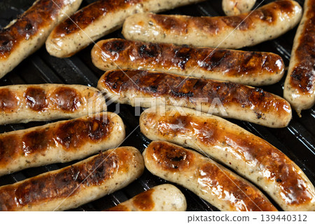 Close-up of Hot Grilled Sausages with Brown Grill Marks Close-up of Hot Grilled Sausages with Brown Grill Marks 139440312