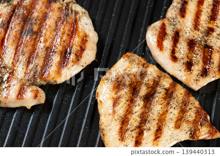 Grilled Turkey Steaks with Perfect Brown Grill Marks Close-up Grilled Turkey Steaks with Perfect Brown Grill Marks Close-up 139440313