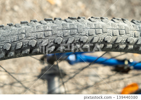 Worn out mountain bike tyre with dry rot cracks. Worn out mountain bike tyre with dry rot cracks. 139440380