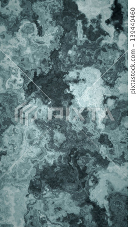 A heavy, flowing marble background in charcoal gray; a vertically elongated abstract texture resembling dark natural stone. A heavy, flowing marble background in charcoal gray; a vertically elongated abstract texture resembling dark natural stone. 139440460
