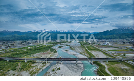 Scenes of the Hokuriku Expressway and Hokuriku Shinkansen viaducts around the Kurobe River in May. Scenes of the Hokuriku Expressway and Hokuriku Shinkansen viaducts around the Kurobe River in May. 139440896