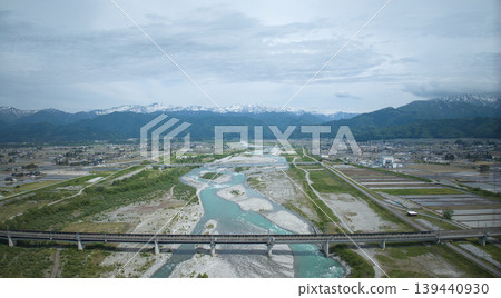 Scenes of the Hokuriku Expressway and Hokuriku Shinkansen viaducts around the Kurobe River in May. Scenes of the Hokuriku Expressway and Hokuriku Shinkansen viaducts around the Kurobe River in May. 139440930