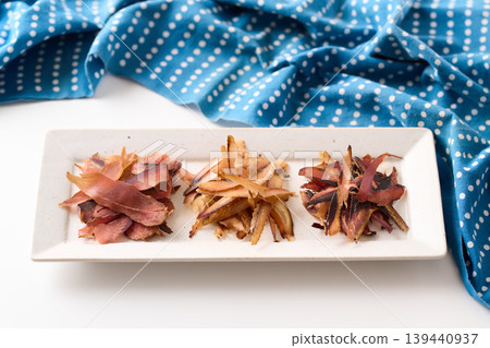Three types of thick-cut bonito flakes: left, katsuobushi; middle, mackerel flakes; right, soda flakes. Three types of thick-cut bonito flakes: left, katsuobushi; middle, mackerel flakes; right, soda flakes. 139440937