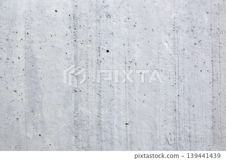 Concrete surface displays its texture and lines under natural light in industrial area during day. Concrete surface displays its texture and lines under natural light in industrial area during day. 139441439