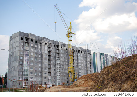Construction of a large multi-story residential building with a crane Construction of a large multi-story residential building with a crane 139441469