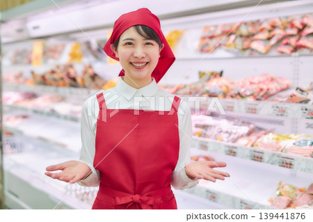 A young woman working at a supermarket's sample counter A young woman working at a supermarket's sample counter 139441876