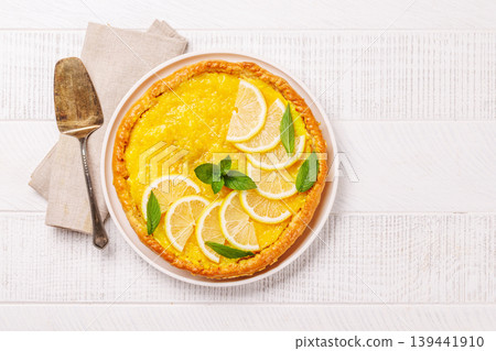 Delicious lemon tart with golden crust and smooth, glossy lemon filling 139441910