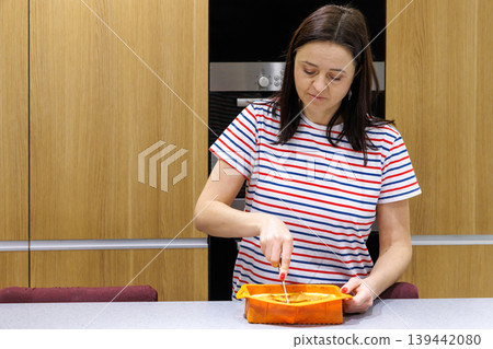 Woman cooking food at home kitchen Woman cooking food at home kitchen 139442080