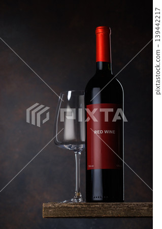 Red bottle with white wine Red bottle with white wine 139442217