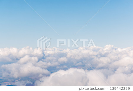 Sunlit sky above clouds from airplane Sunlit sky above clouds from airplane 139442239