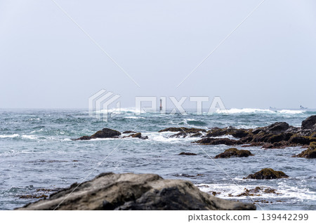 A view of the sea and offshore marker lights from the rocky shore of the Miura Peninsula. A view of the sea and offshore marker lights from the rocky shore of the Miura Peninsula. 139442299
