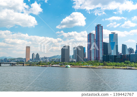 Seoul, South Korea - May. 04, 2026 : High-rise buildings of Yeouido business district and Han River park in spring afternoon, Seoul, South Korea 139442767