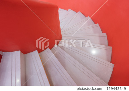 Red and white spiral staircase, minimalist interior architecture. 139442849
