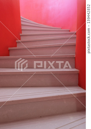 Red and white spiral staircase, minimalist interior architecture. Red and white spiral staircase, minimalist interior architecture. 139442852