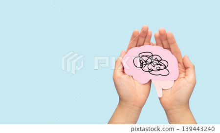Human brain as tangled messy single line on blue background. Concept of mental disorder, ADHD symptom, finding solution, chaotic thinking process, confused mind. Mental health care. Human brain as tangled messy single line on blue background. Concept of mental disorder, ADHD symptom, finding solution, chaotic thinking process, confused mind. Mental health care. 139443240