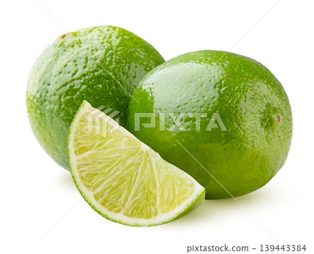 Limes fruits with a slice on a white background. Isolated Limes fruits with a slice on a white background. Isolated 139443384