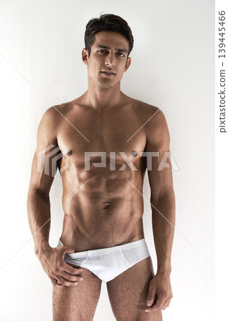 Portrait, muscle and man with underwear, fitness and confident guy isolated on a white studio background. Person, mockup space and model with bodybuilding, healthy and natural with wellness and abs Portrait, muscle and man with underwear, fitness and confident guy isolated on a white studio background. Person, mockup space and model with bodybuilding, healthy and natural with wellness and abs 139445466