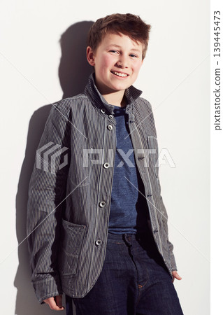 Teenager, fashion and portrait of boy in studio, white background and happiness. Cool, style and child with a smile, pride and confidence in trendy clothes, outfit and personality on backdrop Teenager, fashion and portrait of boy in studio, white background and happiness. Cool, style and child with a smile, pride and confidence in trendy clothes, outfit and personality on backdrop 139445473