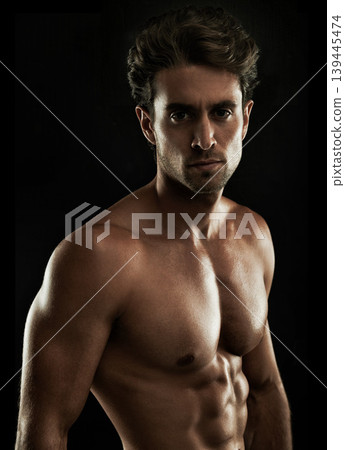 Topless, black background or portrait of man for bodybuilding results, six pack or stomach in studio. Fitness model, dark or ripped person with healthy body, abs or muscle for wellness in Italy 139445474