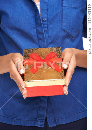 Person, hands and gift box present for celebration for birthday, holiday party or white background. Package, event giving and ribbon for surprise winning giveaway or anniversary, valentines or parcel Person, hands and gift box present for celebration for birthday, holiday party or white background. Package, event giving and ribbon for surprise winning giveaway or anniversary, valentines or parcel 139445519