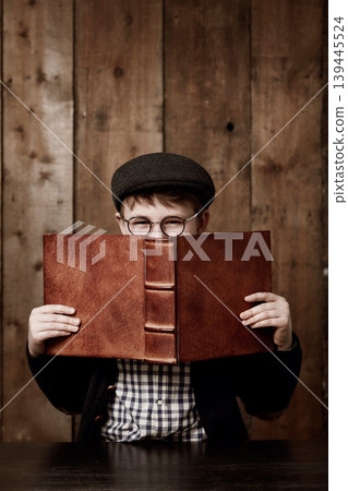 Education book, hidden portrait or child reading information, youth development study or literature story for homework. Knowledge, textbook or scholarship kid, boy or student with learning commitment Education book, hidden portrait or child reading information, youth development study or literature story for homework. Knowledge, textbook or scholarship kid, boy or student with learning commitment 139445524