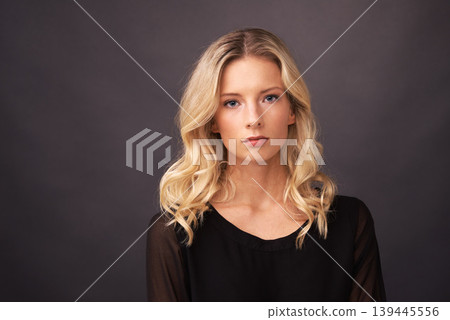 Woman, fashion and face in portrait, stylish and aesthetic by black background. Female model person, classy outfit and beauty or confidence for designer luxury clothing, elegant and hair in studio Woman, fashion and face in portrait, stylish and aesthetic by black background. Female model person, classy outfit and beauty or confidence for designer luxury clothing, elegant and hair in studio 139445556