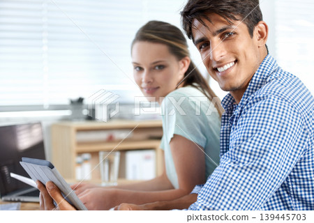 Colleagues, portrait and meeting with tablet, laptop and teamwork for digital planning. Man, woman and technology with email, working or project for conversation, workplace and professional 139445703
