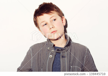 Teen, boy and thinking of fashion in studio, white background or dream of future. Cool, style and child with ideas, creativity and confidence in trendy clothes, outfit and character on backdrop Teen, boy and thinking of fashion in studio, white background or dream of future. Cool, style and child with ideas, creativity and confidence in trendy clothes, outfit and character on backdrop 139445710