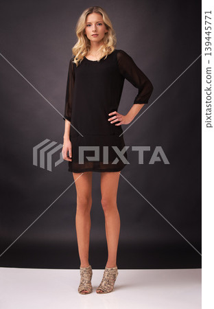 Woman, fashion and style in portrait, studio and confident by backdrop or rich aesthetic. Female model person, classy outfit and beauty or pride for designer luxury clothing, elegant and curly hair Woman, fashion and style in portrait, studio and confident by backdrop or rich aesthetic. Female model person, classy outfit and beauty or pride for designer luxury clothing, elegant and curly hair 139445771