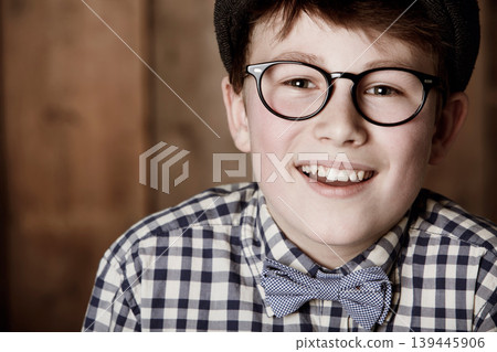 Glasses, happiness and fashion portrait of child smile for lens frame, visual product or youth eyewear. Vision wellness, ocular eye care or face of young kid happy for optical eyeglasses Glasses, happiness and fashion portrait of child smile for lens frame, visual product or youth eyewear. Vision wellness, ocular eye care or face of young kid happy for optical eyeglasses 139445906