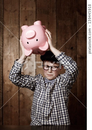 Piggy bank, smash and sad boy child with investment, growth or savings fail at home. Economy, inflation and unhappy kid with money, box or cash container for emergency payment, loan or empty account Piggy bank, smash and sad boy child with investment, growth or savings fail at home. Economy, inflation and unhappy kid with money, box or cash container for emergency payment, loan or empty account 139445918