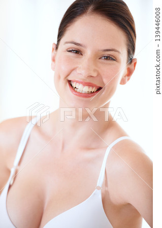 Underwear, bra and happy portrait of woman with confidence in boobs in studio or white background. Sexy, lingerie and model with a smile for body positivity, fashion and self love in brassiere 139446008