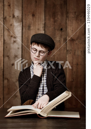 Education book, think and child reading information, youth development study or literature story. Brainstorming, textbook and young kid, boy or student problem solving solution, idea or learning plan Education book, think and child reading information, youth development study or literature story. Brainstorming, textbook and young kid, boy or student problem solving solution, idea or learning plan 139446029