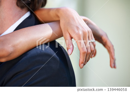 Love, wedding day and hands of bride hug groom in celebration of union, commitment or event closeup. Marriage, ceremony and finger jewellery zoom on ring of woman embracing man with romance or trust 139446058