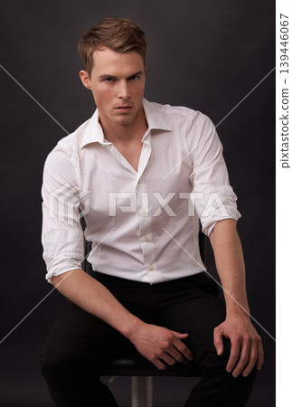 Man, portrait and fashion confidence on black background for clothes outfit, cool style or formal dress up. Male person, model and face for edgy look or mockup space in studio, serious or trendy Man, portrait and fashion confidence on black background for clothes outfit, cool style or formal dress up. Male person, model and face for edgy look or mockup space in studio, serious or trendy 139446067