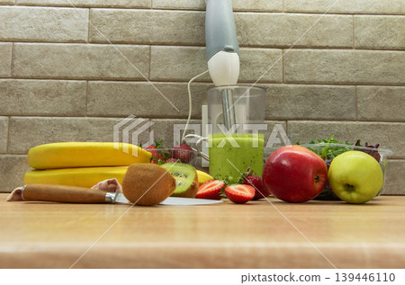 Preparing a healthy green smoothie with fresh fruits Preparing a healthy green smoothie with fresh fruits 139446110