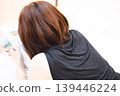 Woman, underwear, bed, reading a magazine, relaxing, image 139446224