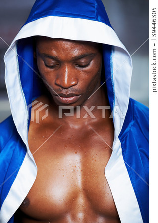 Black man, boxing champion and robe getting ready for fight, challenge or sports competition at gym. Face of serious African male person, fighter or professional boxer in MMA, match or game start Black man, boxing champion and robe getting ready for fight, challenge or sports competition at gym. Face of serious African male person, fighter or professional boxer in MMA, match or game start 139446305