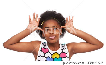 Goofy, funny and portrait of black girl in a studio with tongue out for crazy facial expression. Comedy, joke and young African child with tease, comic and silly face isolated by white background. 139446514