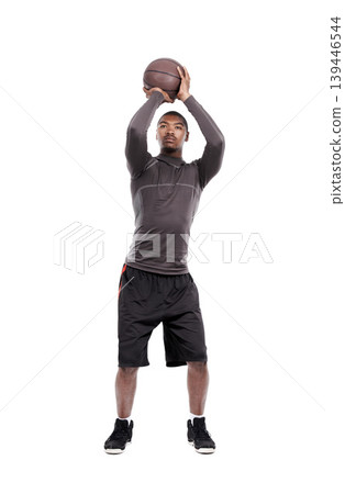Man, basketball player and shooting for exercise, training and serious on white background, concentration or game. Studio, young and sportsman for fitness, health and african active athlete 139446544