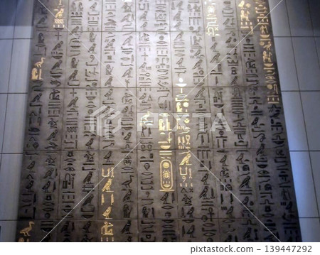 Ancient egyptian hieroglyphics carved into stone wall Ancient egyptian hieroglyphics carved into stone wall 139447292