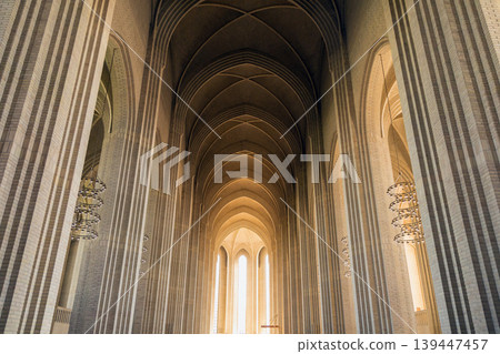 Grundtvigs Church interior with monumental brick arches and Scandinavian Protestant architecture. Grundtvigs Church interior with monumental brick arches and Scandinavian Protestant architecture. 139447457