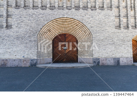 Central entrance with wooden door at Grundtvig Church in Copenhagen. Central entrance with wooden door at Grundtvig Church in Copenhagen. 139447464