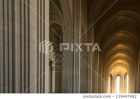 Grundtvigs Church interior with monumental brick arches and Scandinavian Protestant architecture. 139447482