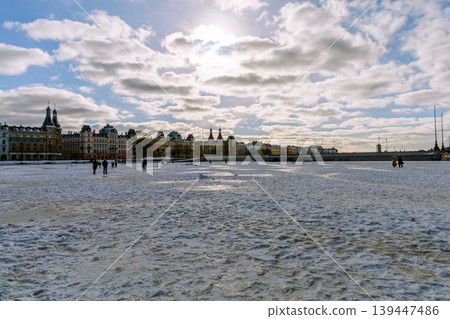 People walking on frozen lake at sunset in Copenhagen during winter. Copenhagen, Denmark 139447486