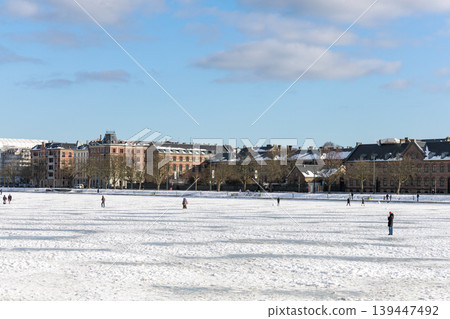 People walking on frozen lake in Copenhagen during unusual winter weather. Copenhagen, Denmark 139447492