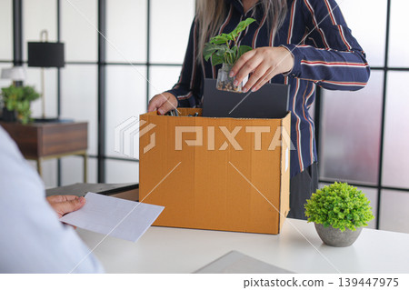 Manager Terminating Employee and Handing Over Severance Document. Manager Terminating Employee and Handing Over Severance Document. 139447975