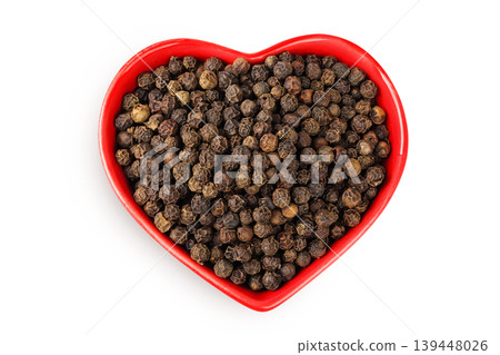 Black peppercorns or pepper in a ceramic bowl isolated on a white background. Top view. Flat lay Black peppercorns or pepper in a ceramic bowl isolated on a white background. Top view. Flat lay 139448026